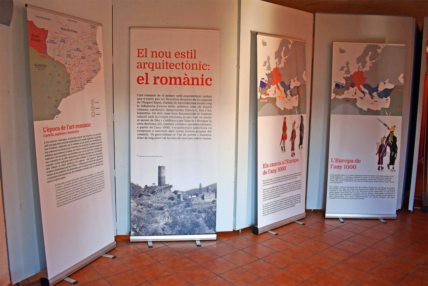 Plafons de lâ€™exposiciÃ³ 'El romÃ nic del temps dâ€™Oliba. Castells, esglÃ©sies i monestirs restaurats per la DiputaciÃ³ de Barcelona' a Cal Balaguer del Porxo.